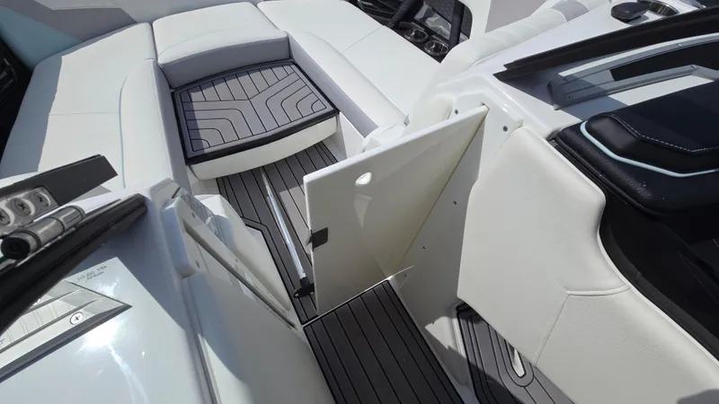 Slide: The Image of 2022 Correct Craft Super Air Nautique G23 interior with sleek seating and modern design. - 28