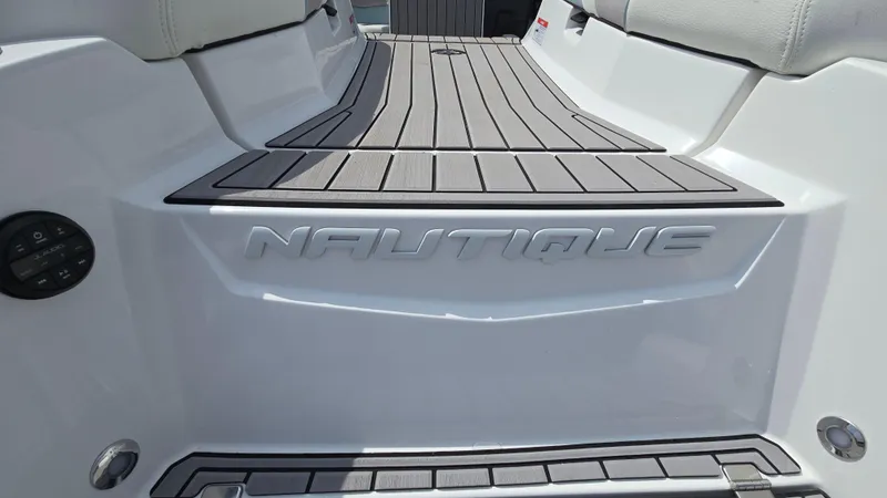Slide: The Image of 2022 Correct Craft Super Air Nautique G23 boat deck with embossed logo. - 31