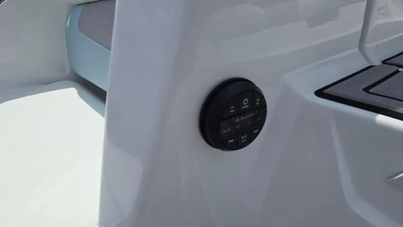 Slide: The Image of Control panel on 2022 Correct Craft Super Air Nautique G23 boat interior. - 32