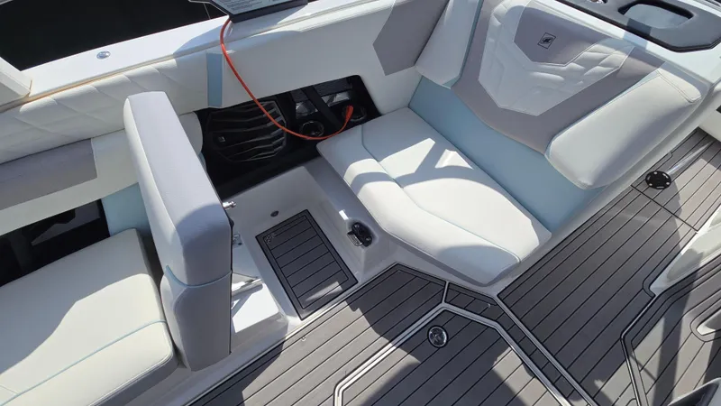 Slide: The Image of 2022 Correct Craft Super Air Nautique G23 interior with sleek seating and modern design. - 33