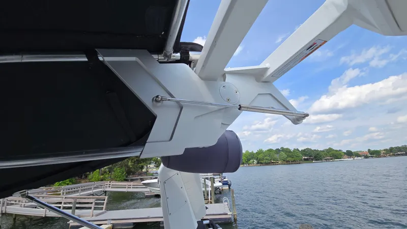 Slide: The Image of 2022 Correct Craft Super Air Nautique G23 boat detail by a lake. - 38