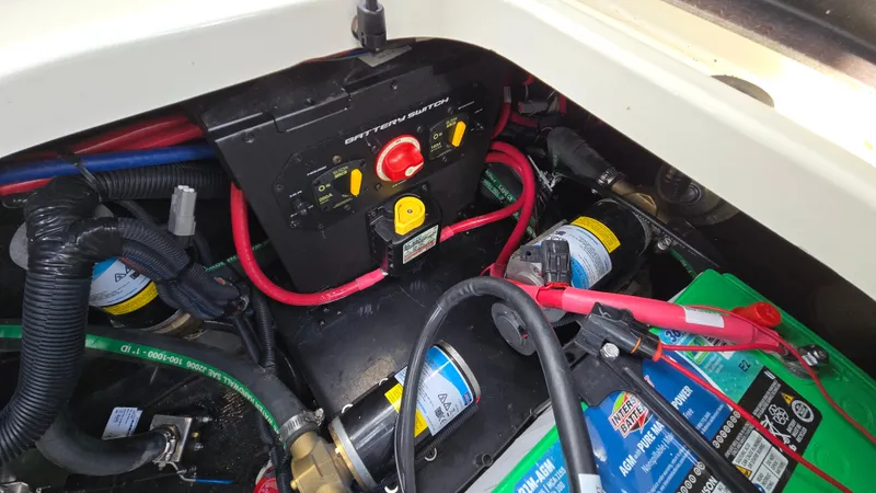 Slide: The Image of Engine compartment of 2022 Correct Craft Super Air Nautique G23 with battery and wiring. - 39