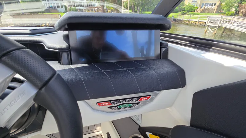 Slide: The Image of 2022 Correct Craft Super Air Nautique G23 dashboard with touchscreen and controls. - 42