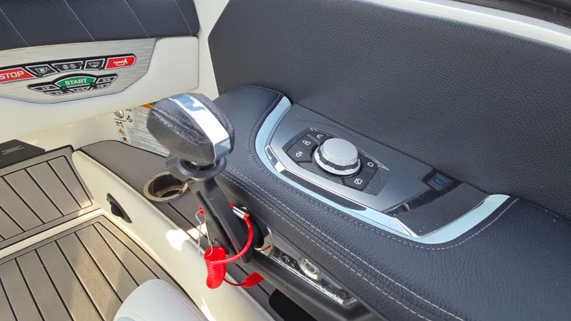 Slide: The Image of Interior controls of a 2022 Correct Craft Super Air Nautique G23 boat. - 43