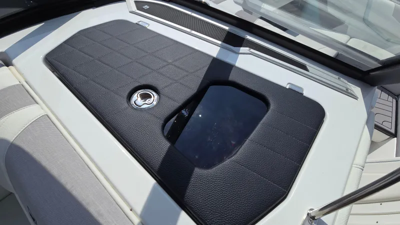 Slide: The Image of 2022 Correct Craft Super Air Nautique G23 boat interior with sleek black panel design. - 45