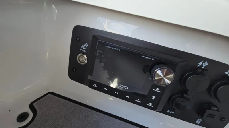 Slide: The Image of 2022 Correct Craft Super Air Nautique G23 audio control panel. - 48