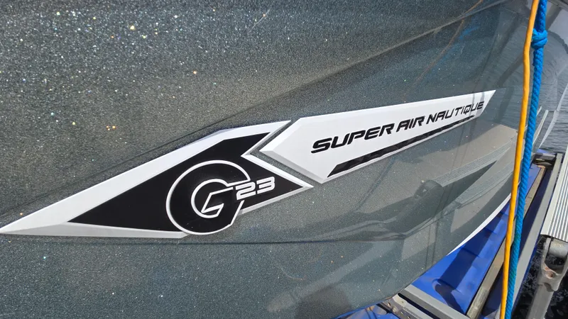 Slide: The Image of 2022 Correct Craft Super Air Nautique G23 boat logo on hull. - 5