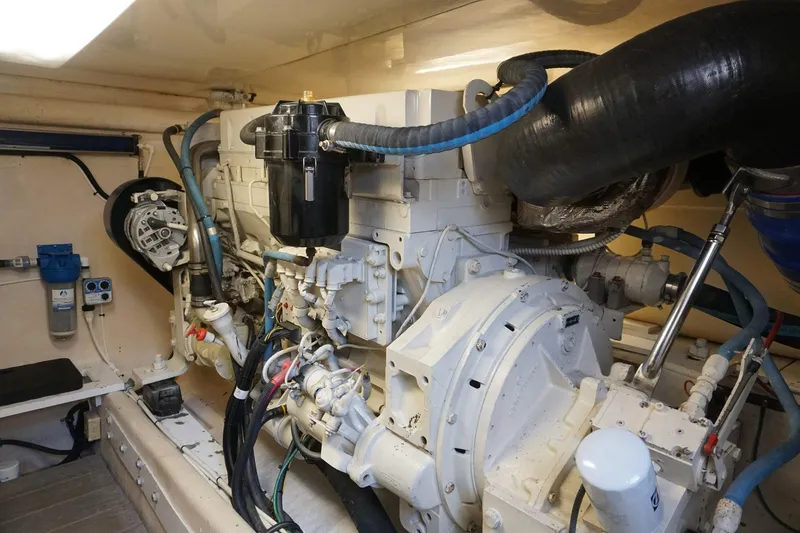 Slide: The Image of Engine room of 2005 Mirage Yachts 40 Convertible, showcasing detailed mechanical components. - 16