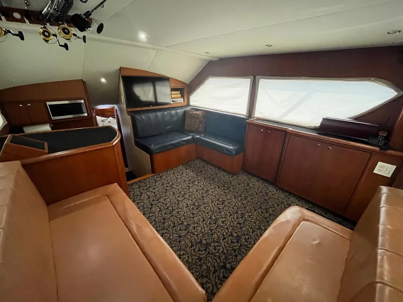 Slide: The Image of Luxurious interior of 2005 Mirage Yachts 40 Convertible with leather seating and elegant wood finishes. - 32