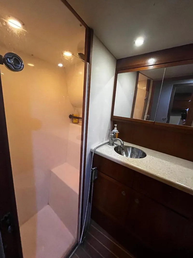 Slide: The Image of Bathroom interior of 2005 Mirage Yachts 40 Convertible with shower and sink. - 36
