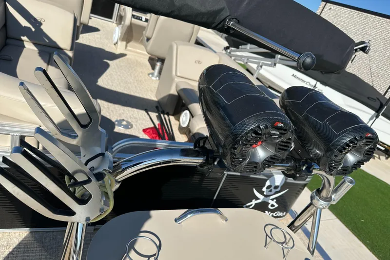Slide: The Image of 2020 Avalon LSZ 2485 QL boat interior with speakers and wakeboard rack. - 10