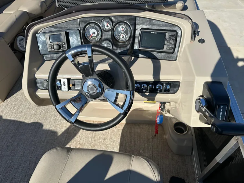 Slide: The Image of Steering console of 2020 Avalon LSZ 2485 QL boat with gauges and controls. - 3