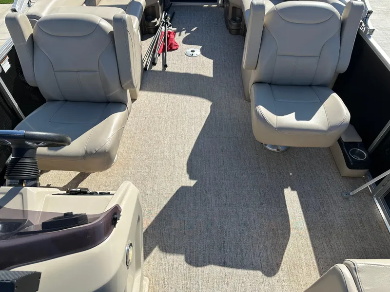 Slide: The Image of 2020 Avalon LSZ 2485 QL boat interior with beige seating and carpeted floor. - 5