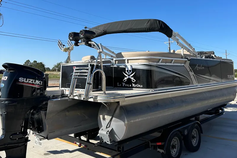 Slide: The Image of 2020 Avalon LSZ 2485 QL pontoon boat on trailer with Suzuki outboard motor. - 8