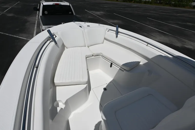 Slide: The Image of 2013 Sea Fox 226 Commander boat with spacious seating in a parking lot. - 16