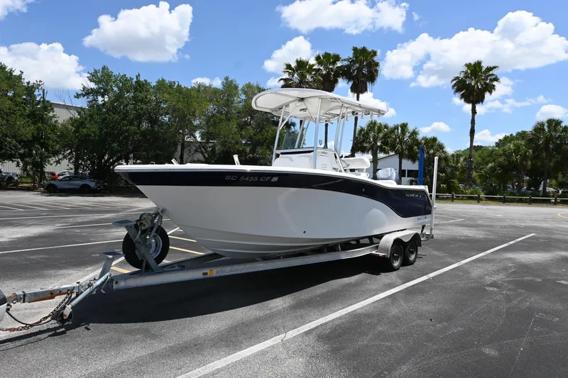 Slide: The Image of 2013 Sea Fox 226 Commander boat on trailer in sunny parking lot. - 6