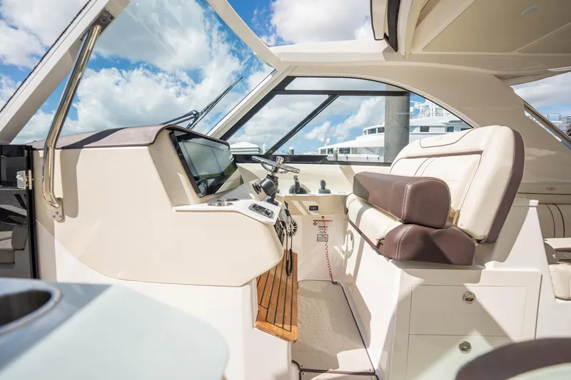 Slide: The Image of Interior of 2022 Regal 36 LX boat with modern helm and seating. - 12