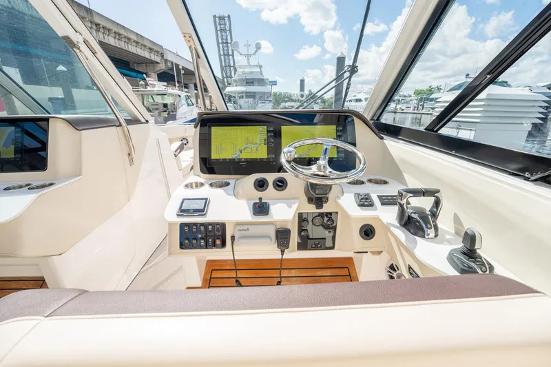 Slide: The Image of 2022 Regal 36 LX boat cockpit with modern navigation system and steering wheel. - 16