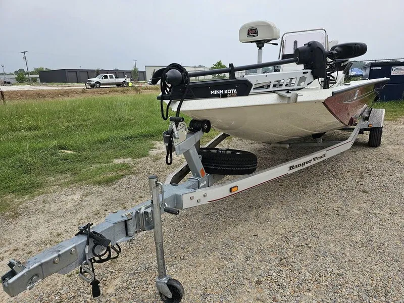 Slide: The Image of 2020 Ranger RB 190 boat on trailer with Minn Kota motor, parked on gravel. - 3