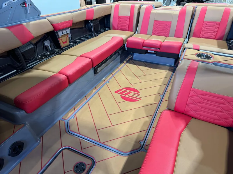 Slide: The Image of 2023 Malibu Wakesetter 26 LSV interior with red and tan seating, stylish design. - 15