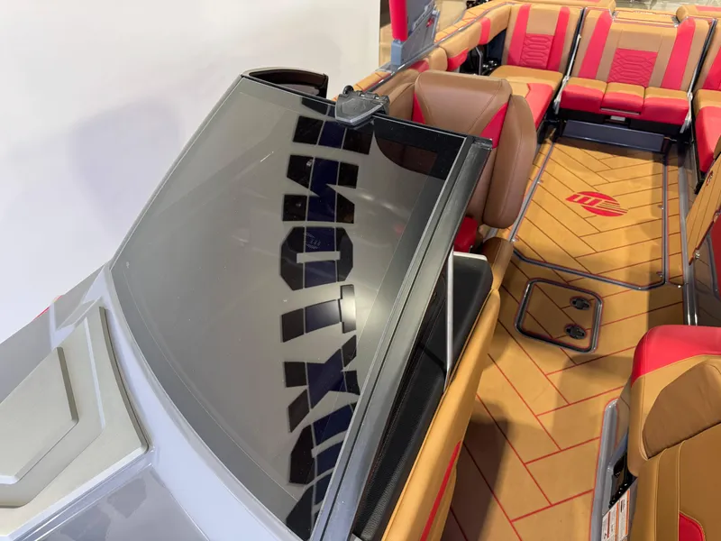 Slide: The Image of 2023 Malibu Wakesetter 26 LSV interior with red and tan seating, sleek design. - 20