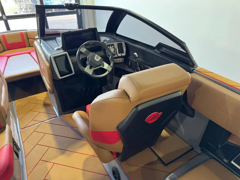 Slide: The Image of 2023 Malibu Wakesetter 26 LSV interior with modern dashboard and luxurious seating. - 24