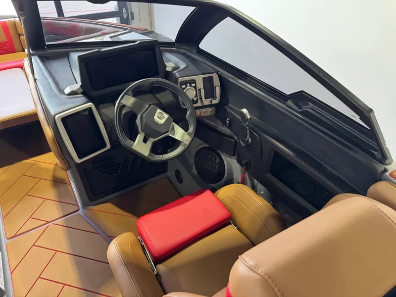 Slide: The Image of 2023 Malibu Wakesetter 26 LSV interior with modern dashboard and steering wheel. - 25