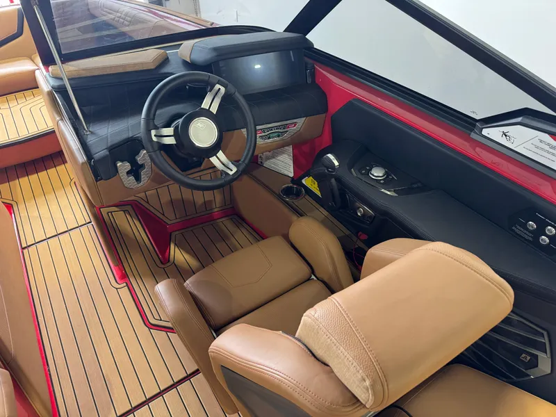 Slide: The Image of 2024 Nautique Super Air Nautique G25 interior with sleek dashboard and luxurious seating. - 24