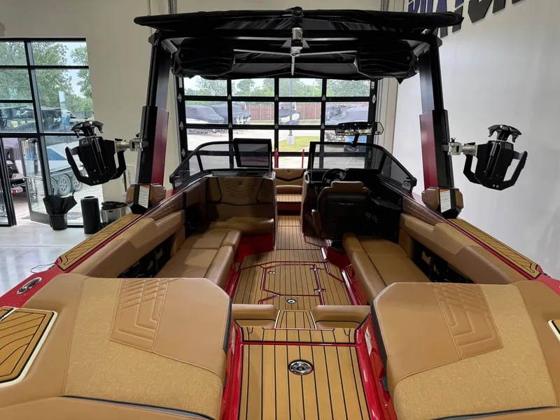 Slide: The Image of 2024 Nautique Super Air Nautique G25 interior with tan seating and sleek design. - 8