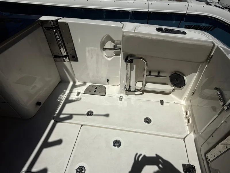 Slide: The Image of 2017 Boston Whaler 320 Vantage boat deck with seating and storage compartments. - 12