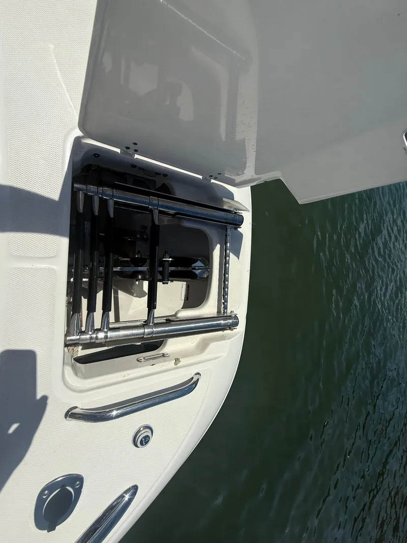 Slide: The Image of 2017 Boston Whaler 320 Vantage swim ladder on water. - 21