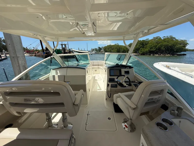 Slide: The Image of Interior view of 2017 Boston Whaler 320 Vantage boat with helm and seating. - 3