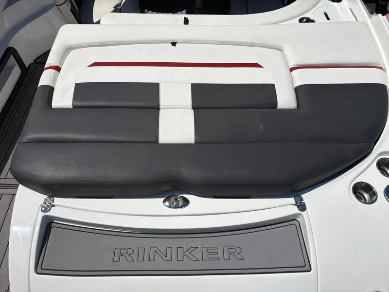 Slide: The Image of 2018 Rinker 26QX BR boat seating with stylish black and white upholstery. - 11
