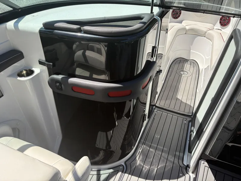 Slide: The Image of 2018 Rinker 26QX BR boat interior with sleek seating and modern design. - 25