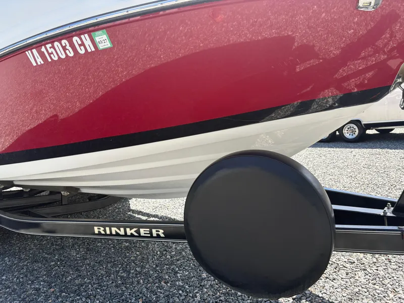 Slide: The Image of 2018 Rinker 26QX BR boat on trailer, red and white hull, side view. - 35