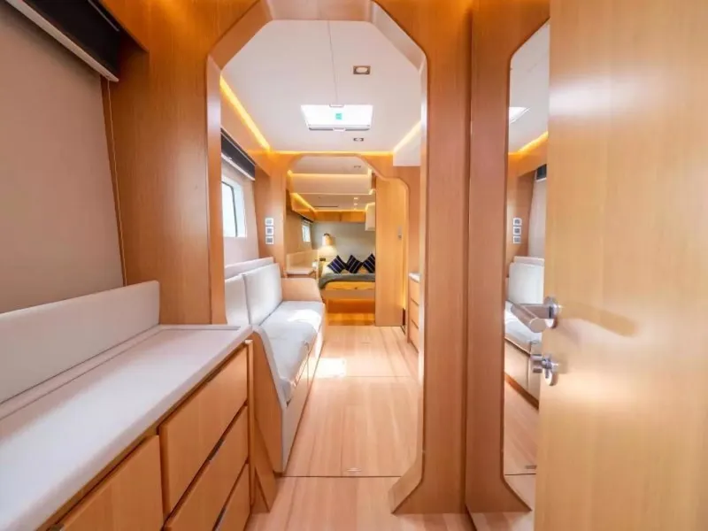 Slide: The Image of Luxurious interior of 2026 McConaghy MC63P Offshore yacht with modern wood finish. - 15
