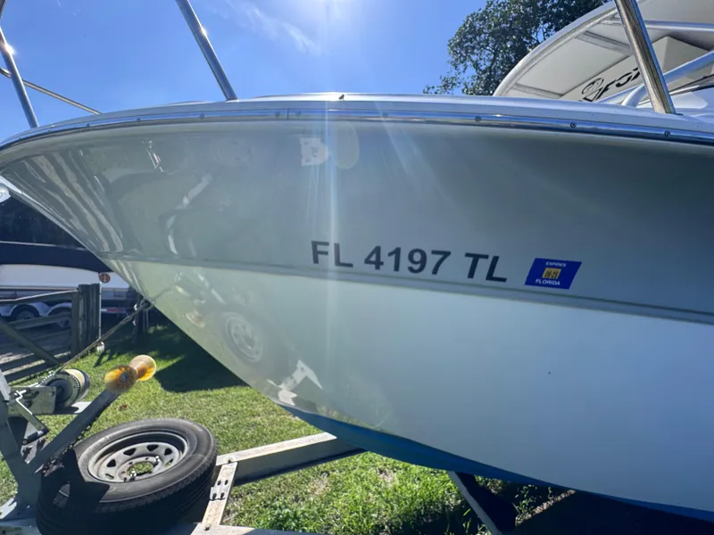 Slide: The Image of 2011 Sea Fox 256 WA Voyager boat on trailer, registration FL 4197 TL visible. - 19