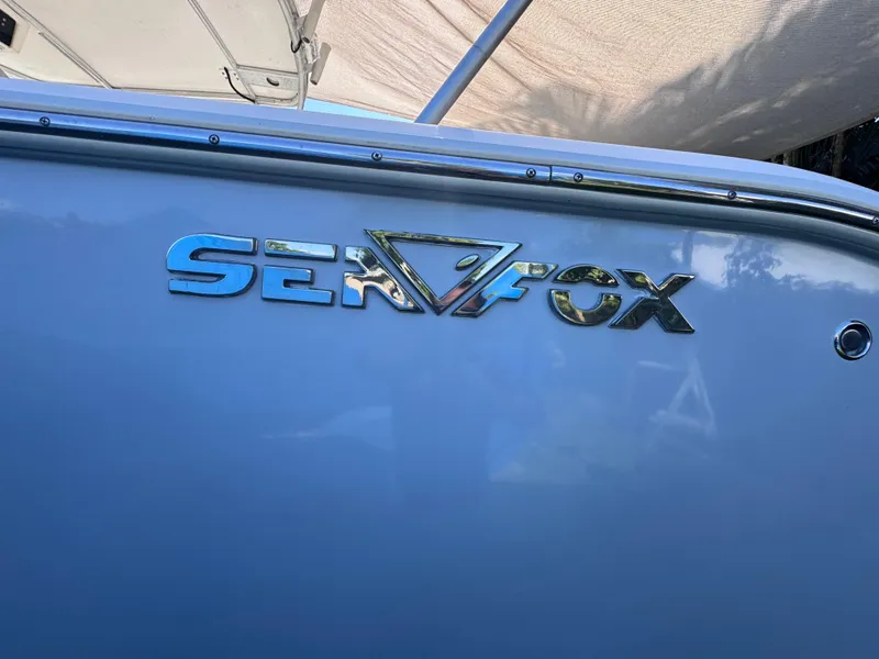 Slide: The Image of 2011 Sea Fox 256 WA Voyager boat logo on hull. - 22