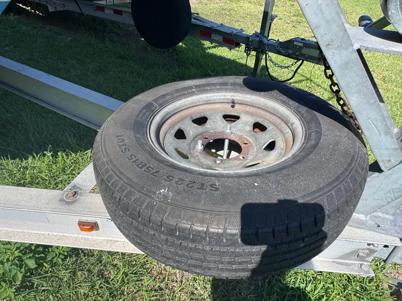 Slide: The Image of Spare tire on a Sea Fox 256 WA Voyager trailer, 2011 model. - 25