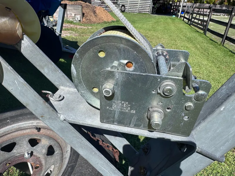 Slide: The Image of Winch mechanism on a 2011 Sea Fox 256 WA Voyager boat trailer. - 26