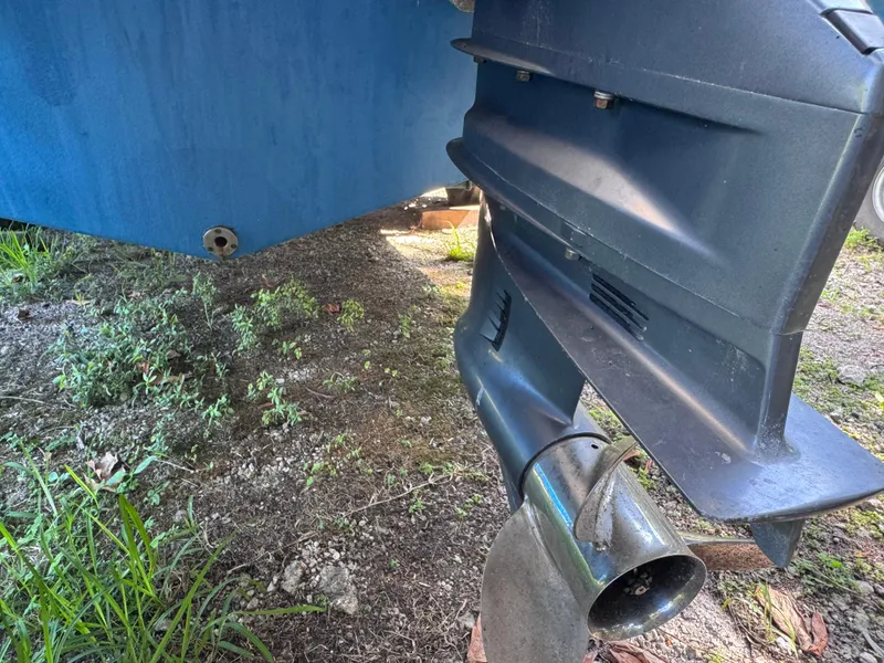 Slide: The Image of 2011 Sea Fox 256 WA Voyager boat propeller and hull on grassy ground. - 28