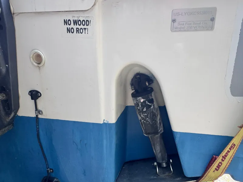 Slide: The Image of 2011 Sea Fox 256 WA Voyager boat hull with "No Wood! No Rot!" sign. - 32