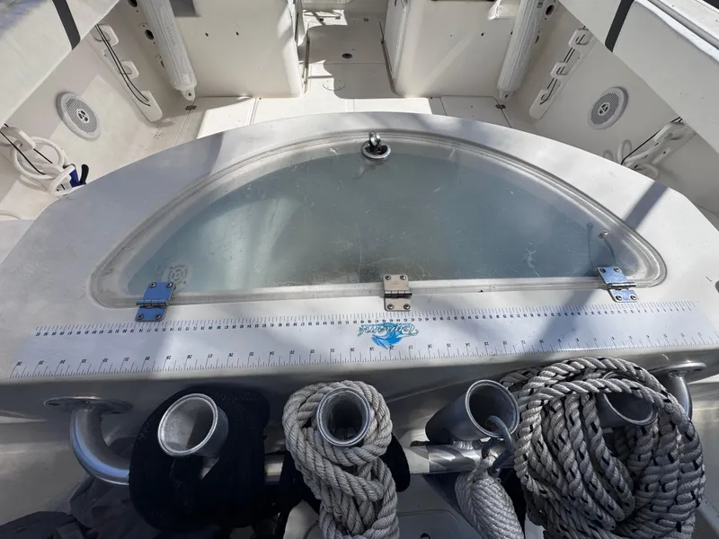 Slide: The Image of 2011 Sea Fox 256 WA Voyager boat deck with ropes and storage compartment. - 41