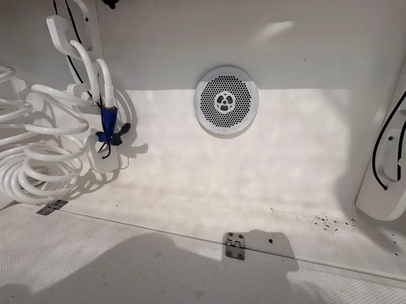 Slide: The Image of 2011 Sea Fox 256 WA Voyager boat interior with speaker and coiled cables. - 44