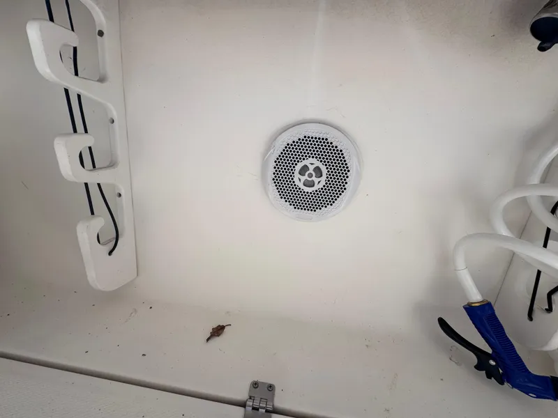 Slide: The Image of 2011 Sea Fox 256 WA Voyager boat interior with speaker and rod holders. - 45