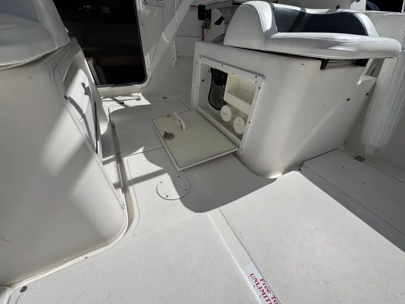 Slide: The Image of 2011 Sea Fox 256 WA Voyager boat interior with open storage compartment. - 46