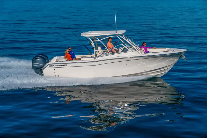 The Image of 2026 Grady-White Freedom 275 boat cruising on calm blue water. - 1