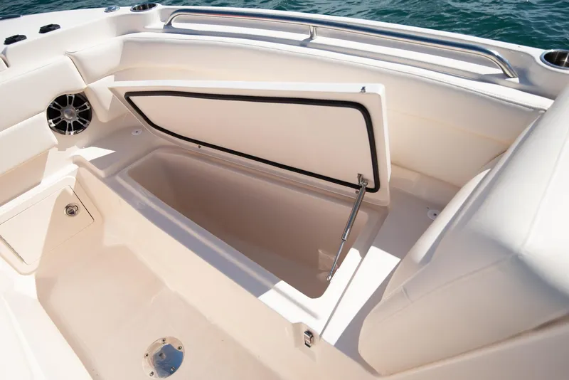 Slide: The Image of 2026 Grady-White Freedom 275 boat interior with storage drawers and seating. - 11