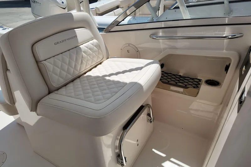 Slide: The Image of 2026 Grady-White Freedom 275 boat seat with quilted design and storage compartment. - 18