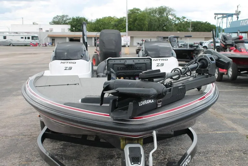 Slide: The Image of 2012 Nitro Z-9 boat with Lowrance equipment, parked outdoors. - 2